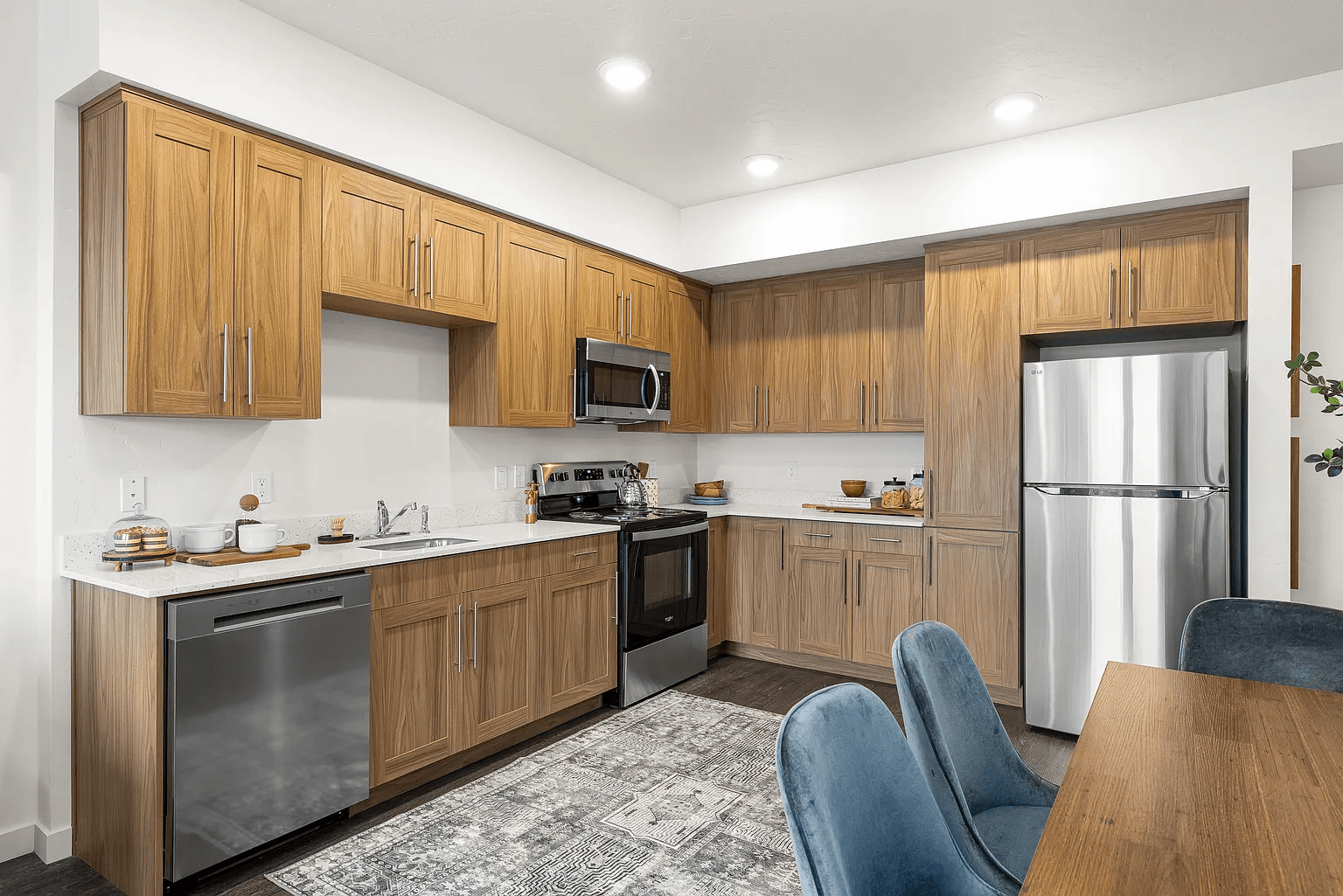 A kitchen with wooden cabinets and stainless steel appliances.